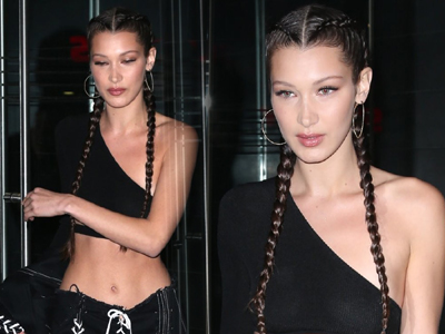 嫩模贝拉辫子头前卫 露脐斜肩上衣秀半球