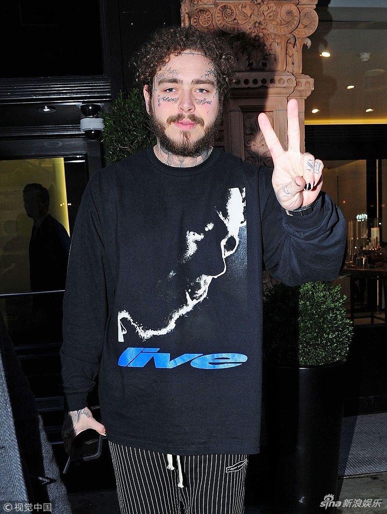 组图:波兹·马龙现身伦敦惹争执 被警方"点名"叼烟比v显不羁