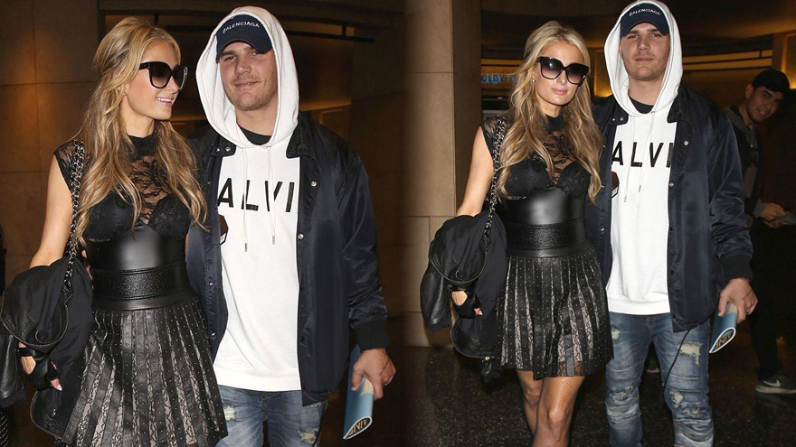 名媛希尔顿穿透视黑裙秀腿 获帅气未婚夫相伴超登对