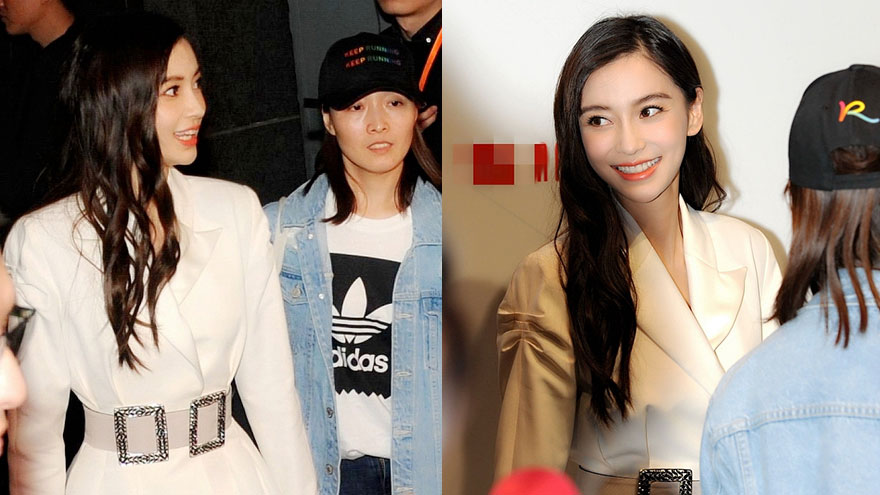 Angelababy白裙优雅卷发似洋娃娃 笑容甜美与人打招呼