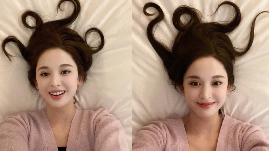 娜扎将头发摆成2021跨年 绿洲穿粉色针织衫可爱比心