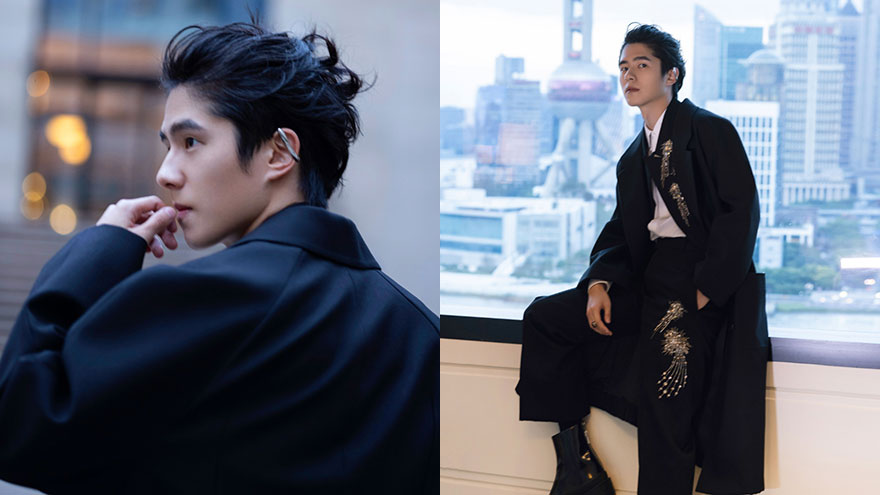 刘昊然穿黑色廓形风衣现身 梳背头戴耳夹硬朗帅气