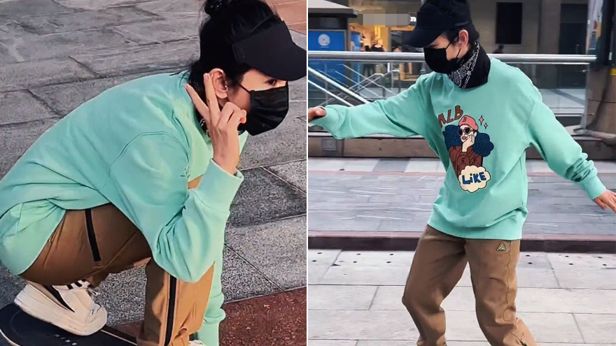 李冰冰广场玩滑板 穿绿色卫衣休闲裤下蹲扭腰姿势专业