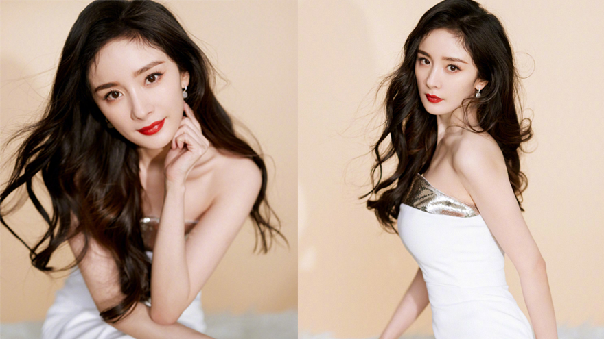 杨幂一袭白色抹胸长裙优雅迷人 波浪卷发披肩红唇吸睛