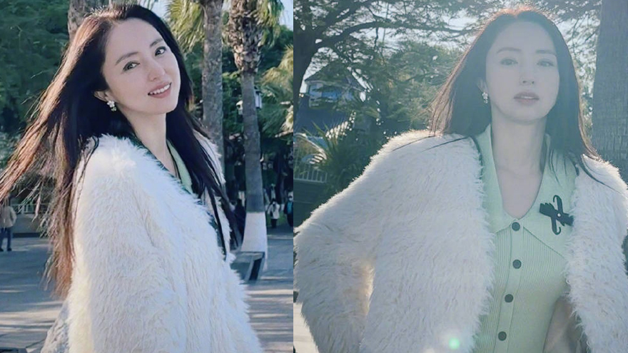 董璇晒冬日海边随拍 阳光下回眸甜笑秀发飞扬