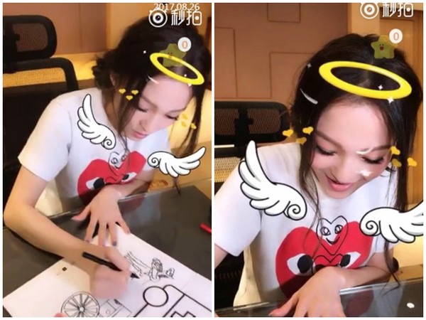 张韶涵一边画画，一边清唱《手心的太阳》