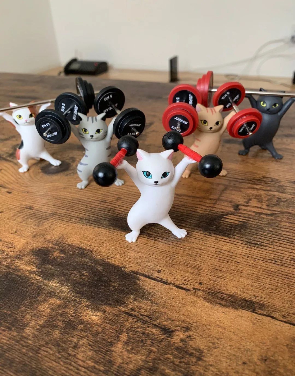 这个猫咪笔架有点可爱得过了头