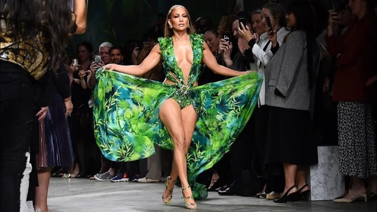 Jennifer Lopez walks the runway for Versace, recreating the classic look of the year