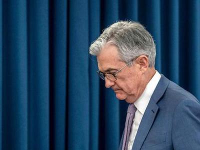 美联储保持近零利率 强化购债指引 上调经济预期