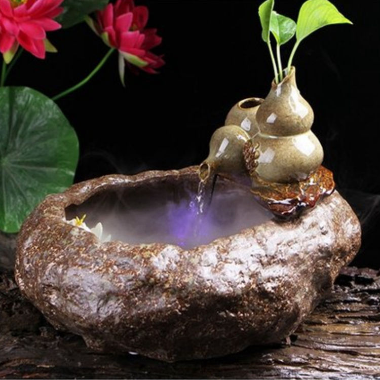 越来越多的有钱人家择创意流水摆件寓意财源茂盛来年大展宏图