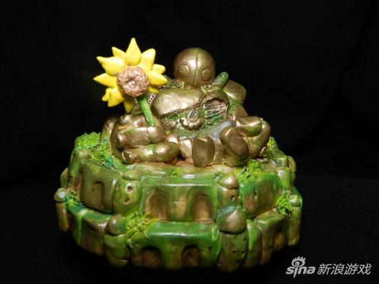 布里茨左手护着倒塌的大楼，右手拿着象征幸福太阳的向日葵