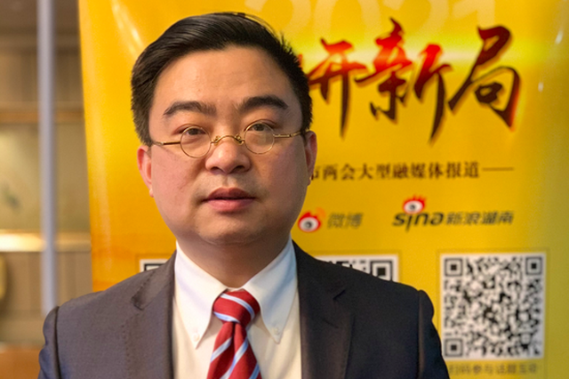 长沙市政协委员李丹大力推进小区业主委员会的建立