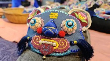 十八洞“虎头帽”惊艳世界
