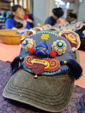 十八洞“虎头帽”惊艳世界