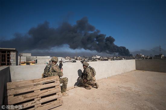 资料图：在伊拉克执行任务的美国军人（视觉中国）
