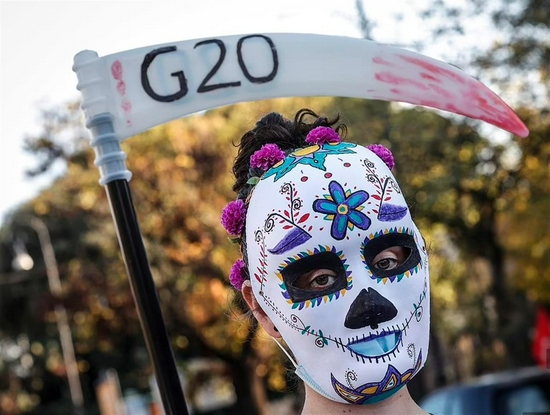 During the protest, a demonstrator wore a mask of death