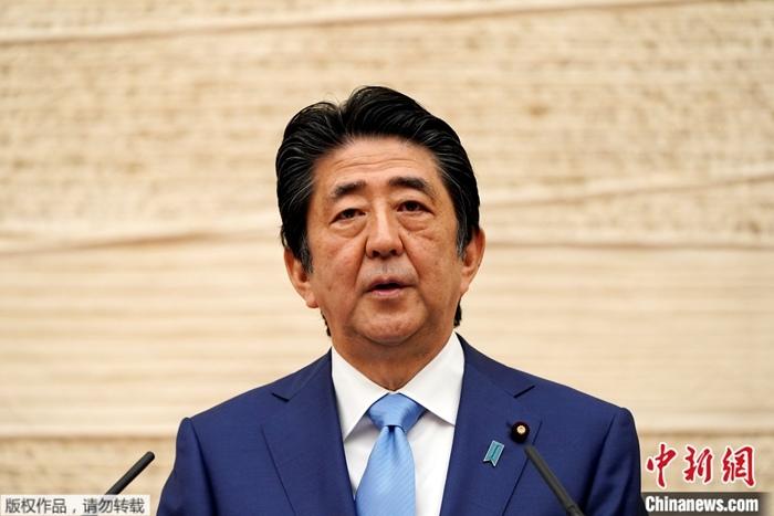 原料图:日本始相安倍晋三。