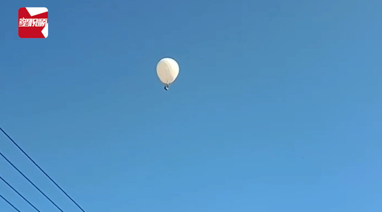 视频-吉林2名村民坐氢气球打松籽飞上天,落地后被警方带走