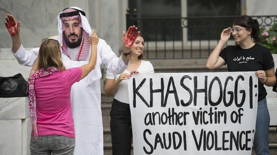 民众游行要求美国制裁沙特（图：美联）