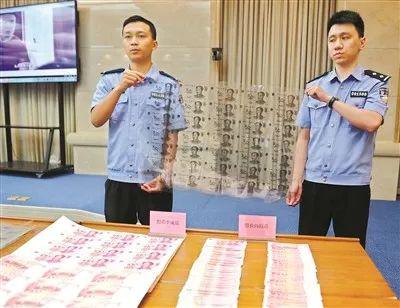 犯罪分子制造的假币和制假币使用的胶片。 广州日报全媒体记者乔军伟摄