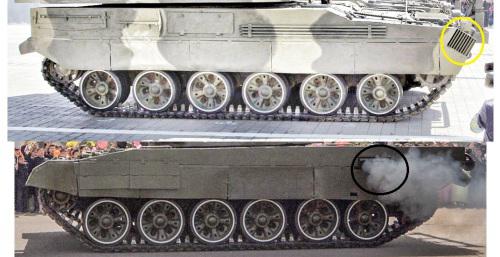 此次阅兵中的新款自行火炮底盘（下）和先军915坦克（上）底盘对比图。不难发现新款自行火炮将T-72坦克上的排气装置（上图黑圈），移动到了主动轮上方（上图黄圈）。