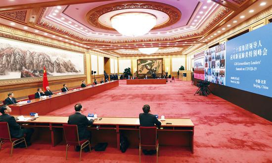  2020年3月26日，国家主席习近平在北京出席二十国集团领导人应对新冠肺炎特别峰会并发表题为《携手抗疫 共克时艰》的重要讲话。 新华社记者 庞兴雷/摄