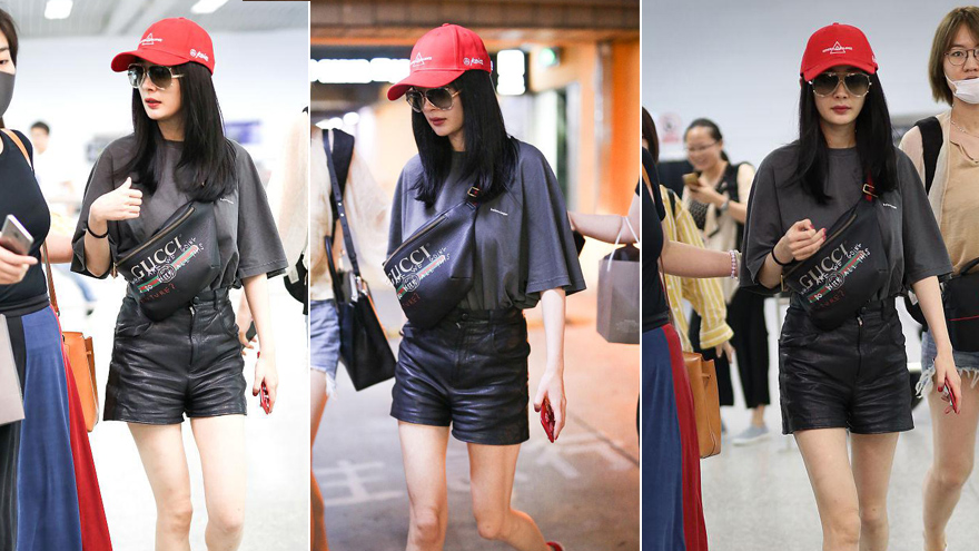 杨幂戴小红帽现身机场 胸前斜挎包气场强