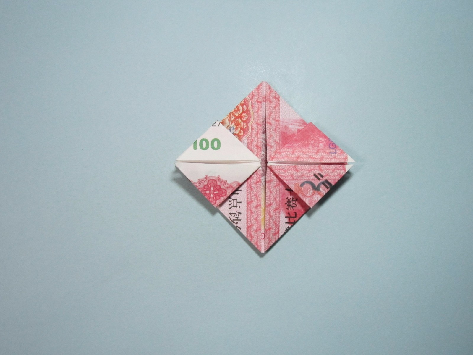 用人民币折纸爱心详细图解放在钱包里的爱心