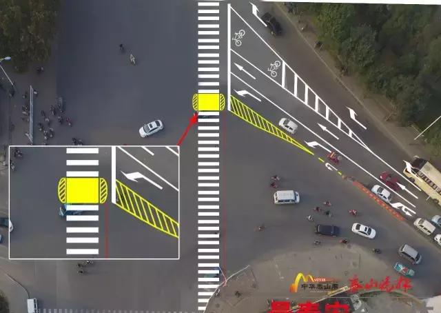 灵山大街龙潭路路口改标线了,并设城区首个"二次过街安全岛"!