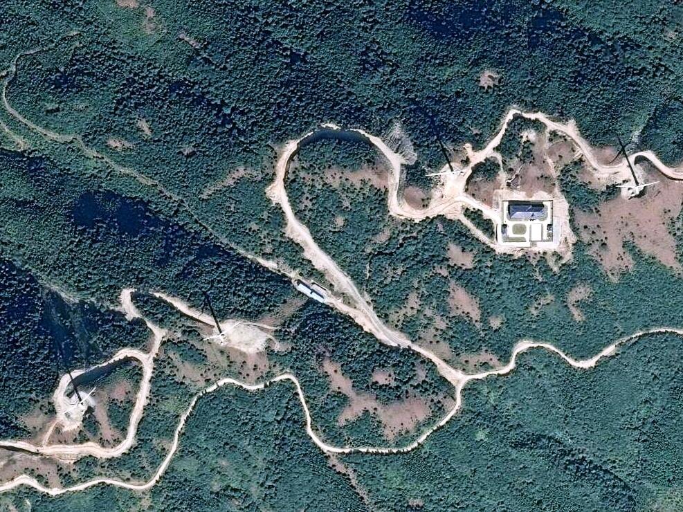 美国"地球眼"卫星看玉林 大容山百米风电机如同牙签