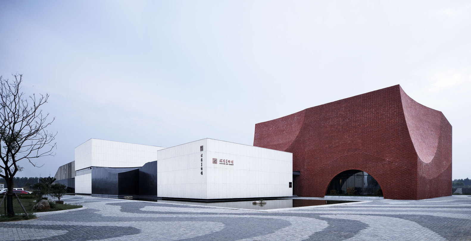 沭阳美术馆 / 浙江大学建筑设计研究院 项目位于传统书法之乡——江