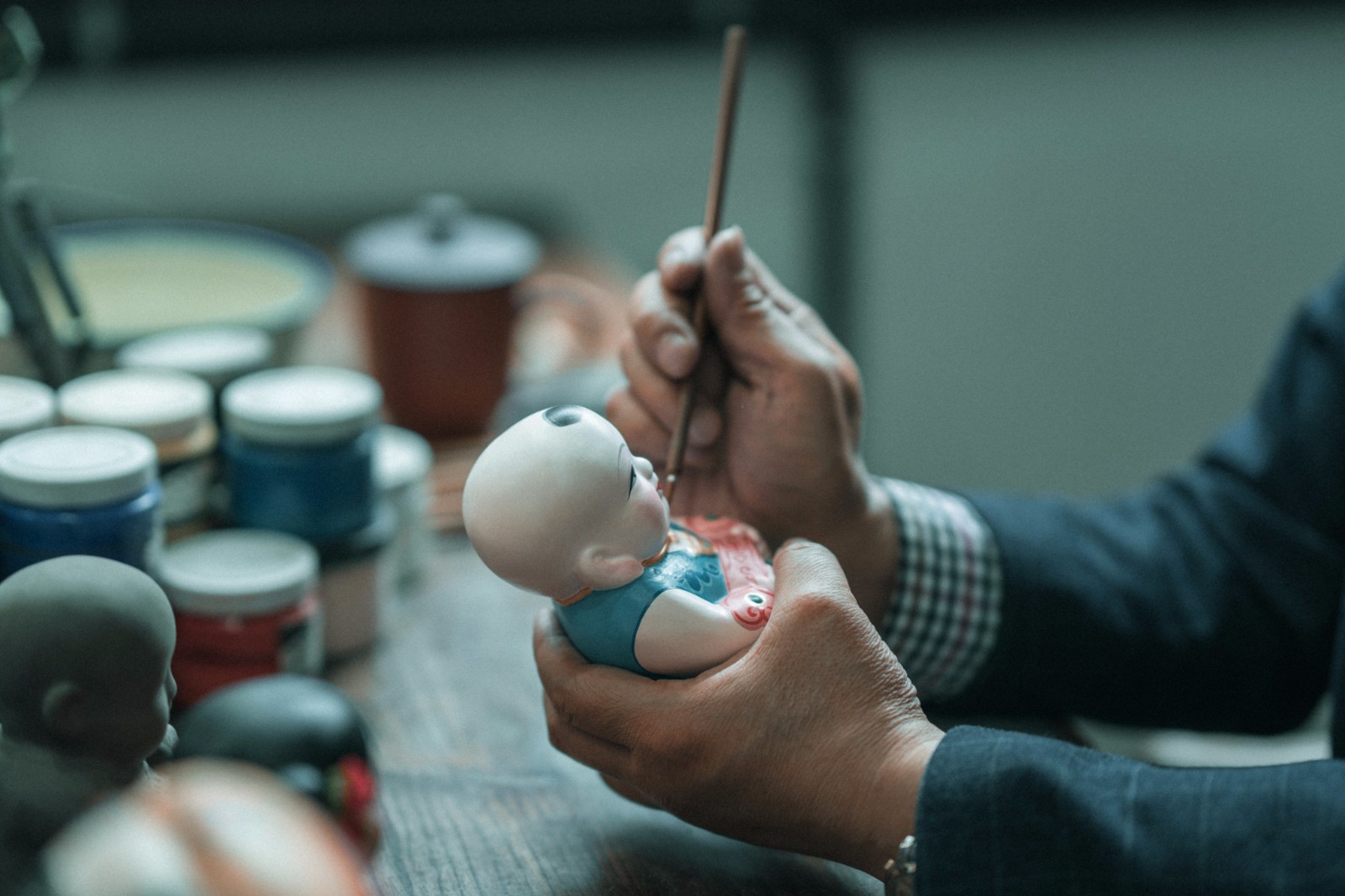 无锡惠山古镇大师们是这样做泥人的