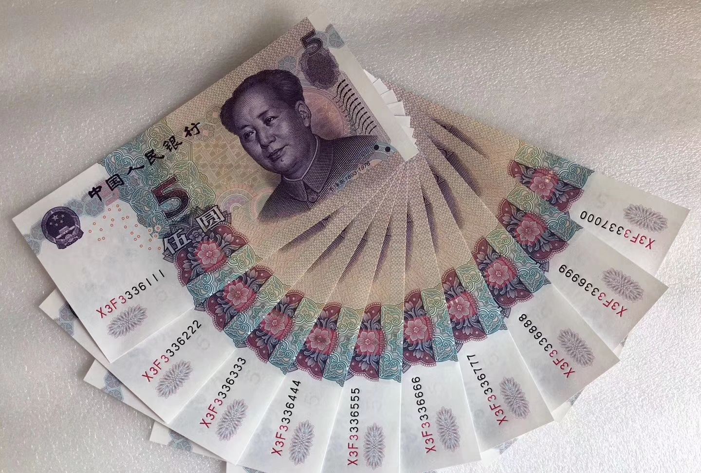 第五套人民币,正面的花卉图案和背面的山水图案,你知道吗?