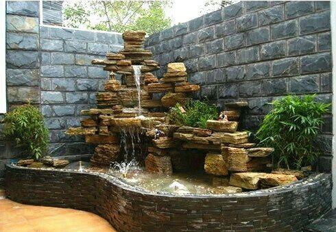 庭院假山流水瀑布在庭院中,已成为园林景观庭院不可或缺的因素.