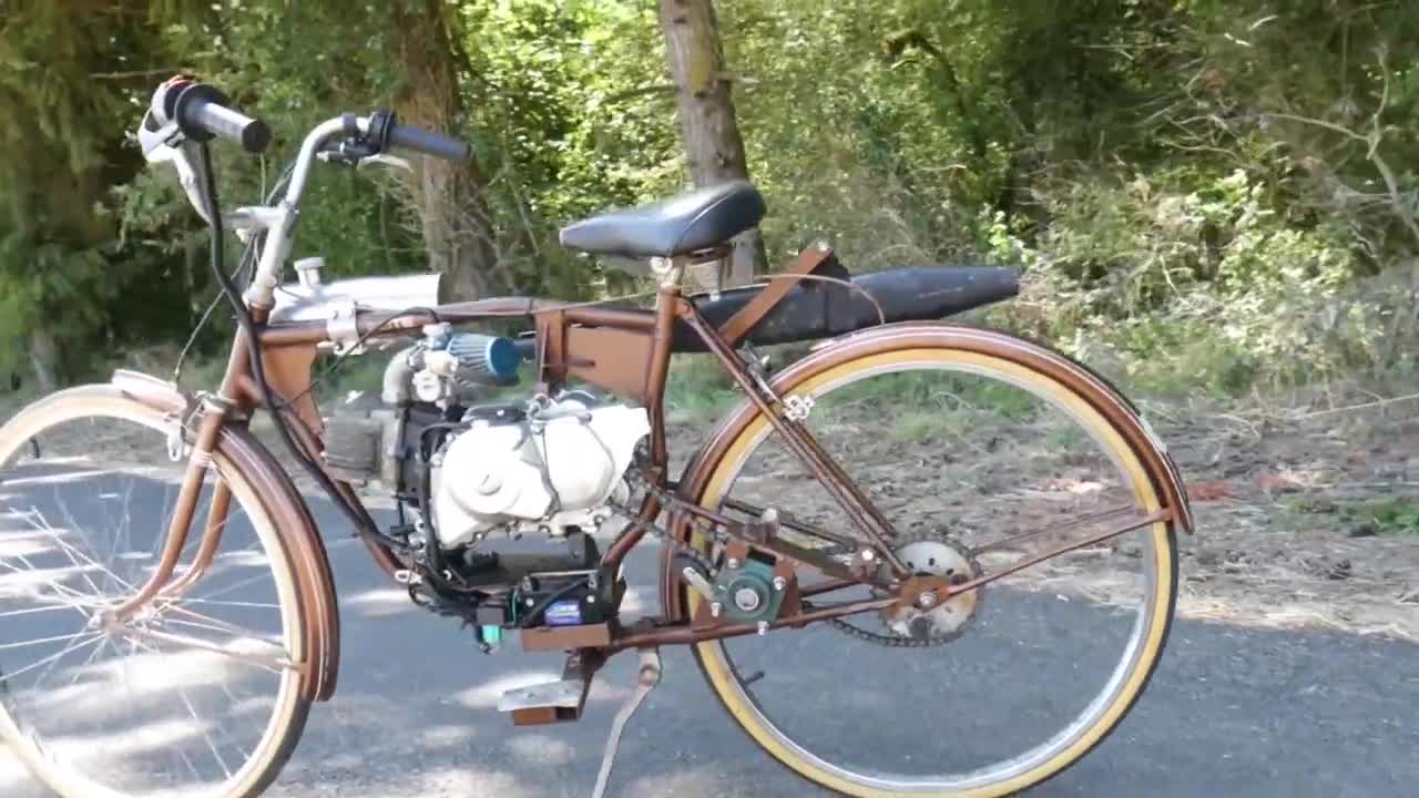 给自行车装台摩托发动机,开起来挺带劲,就是担心小车架受不住__财经