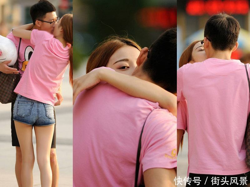 身穿情侣装的一对情侣大街上大胆秀恩爱视旁人为空气