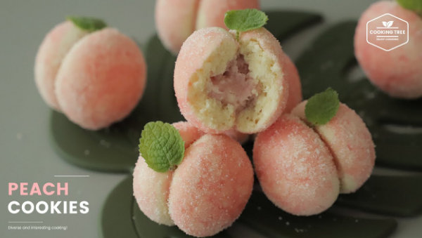 这个桃子饼干也太好看了吧!想次~粉嫩的外皮包裹着桃肉做的夹心