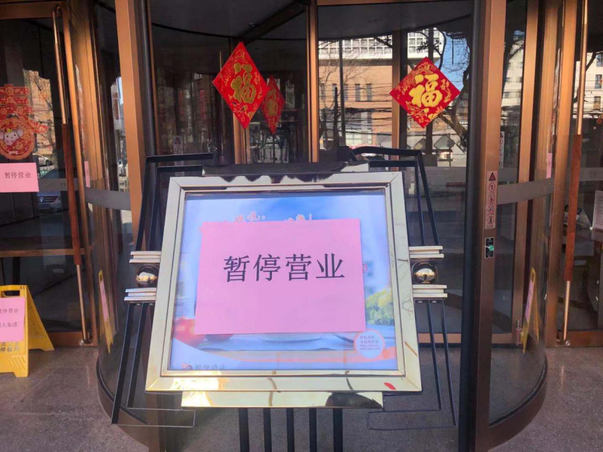 图丨疫情众生相:双黄连限购,超市排队隔1米,社区"硬核"防控