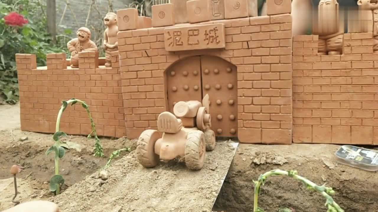 二蛋骑三轮车,进泥巴城卖豆腐,泥巴用手工泥塑造了一个城池