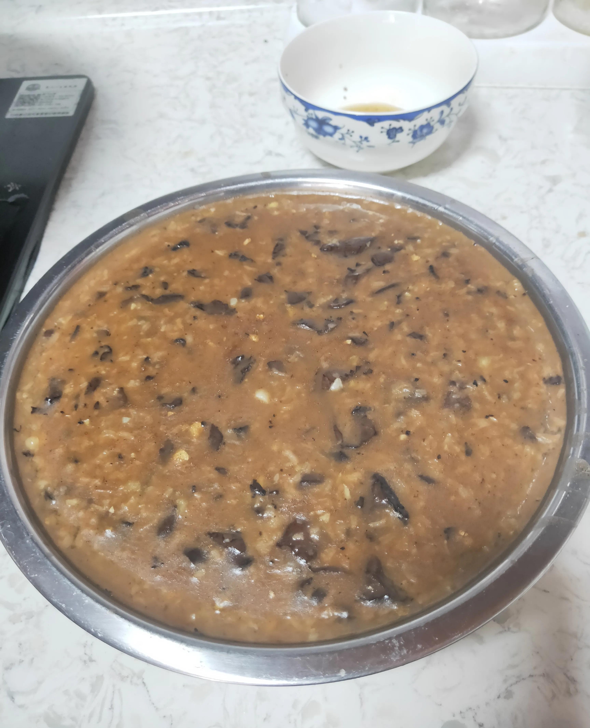 又称酸糟粥,当地壮语称为"竹什",是一种广泛流传于广西崇左的特色美食