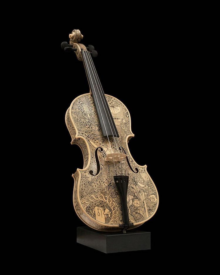 华丽的墨水画把弦乐器变成了非传统的故事书意大利艺术家 leonardo