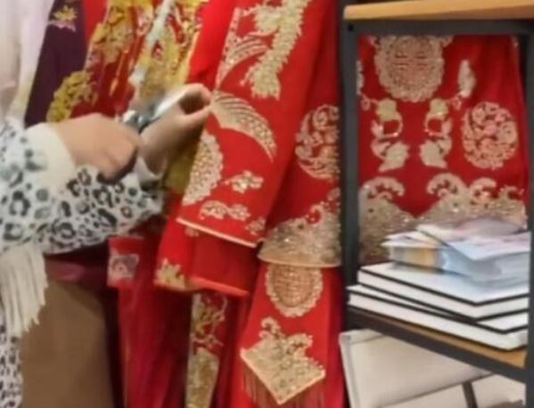 怒剪32件婚纱事件双方达成5万赔偿 婚礼店：不想把人逼到绝路休闲区蓝鸢梦想 - Www.slyday.coM