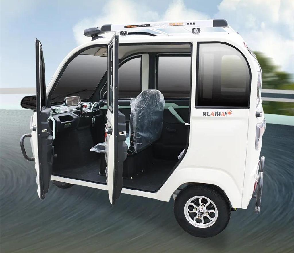 淮海推出qg50全封闭电动三轮车五门大空间续航超百里可载人