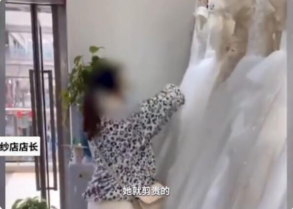 热搜第一！怒剪32件婚纱事件双方达成5万赔偿 店家：不想把人逼到绝路休闲区蓝鸢梦想 - Www.slyday.coM