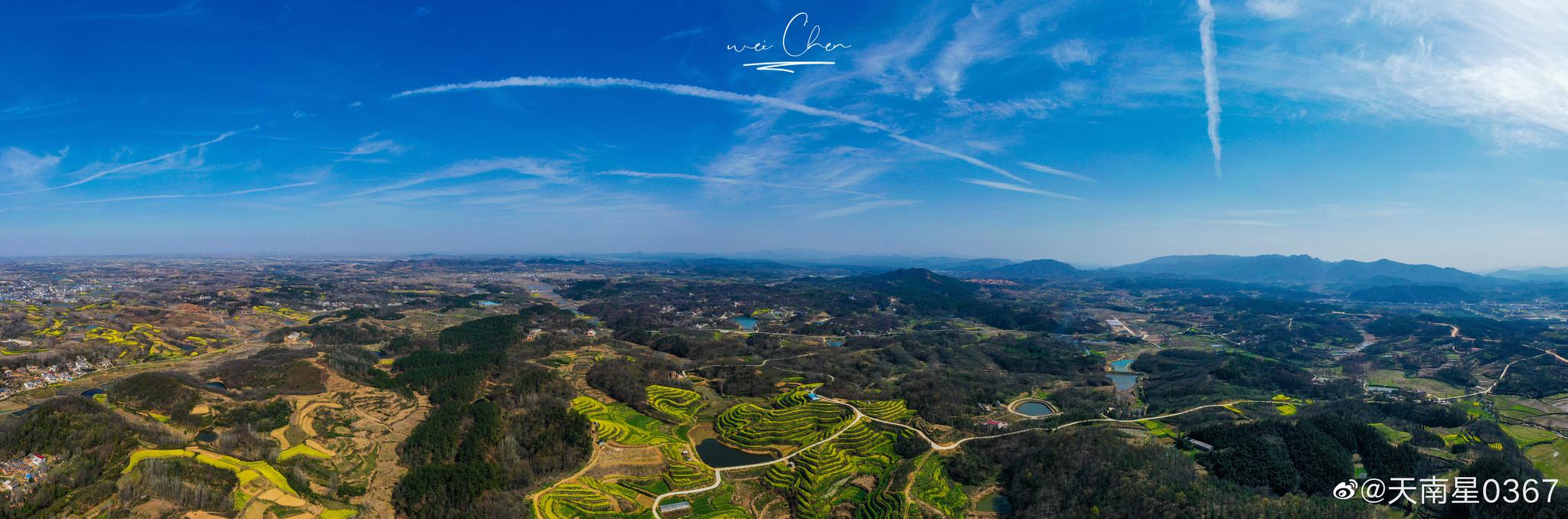 新县吴陈河乡,奇龙岭油菜花海.  676767 图/@天南星0367