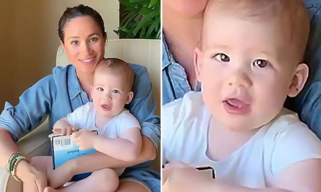 阿奇小王子1岁啦窝在妈妈怀里啃书兜着尿不湿样子真可爱