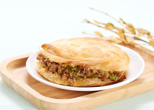 一个巴掌大的小饼配上热腾腾的卤肉就是让人神往的西安肉夹馍