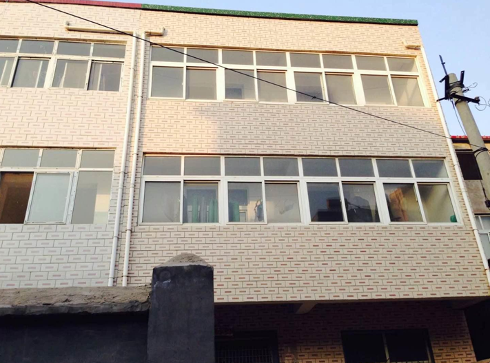 (刁先生家被拆迁之前所住的三层房屋)