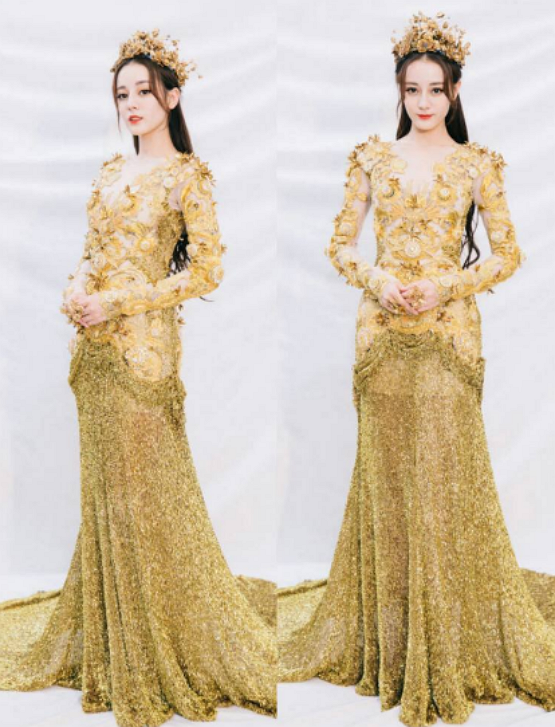 说实话热巴的这件金鹰女神战袍也有点"丑",服装整体略显浮夸,颜色更像