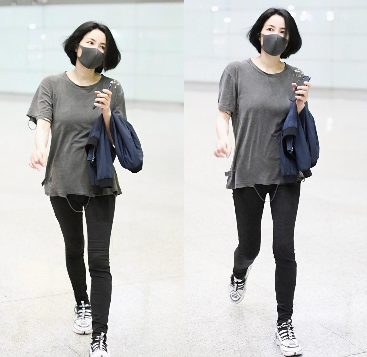 王菲罕见走机场黑色大棉服包得严严实实一点偶像包袱都没有